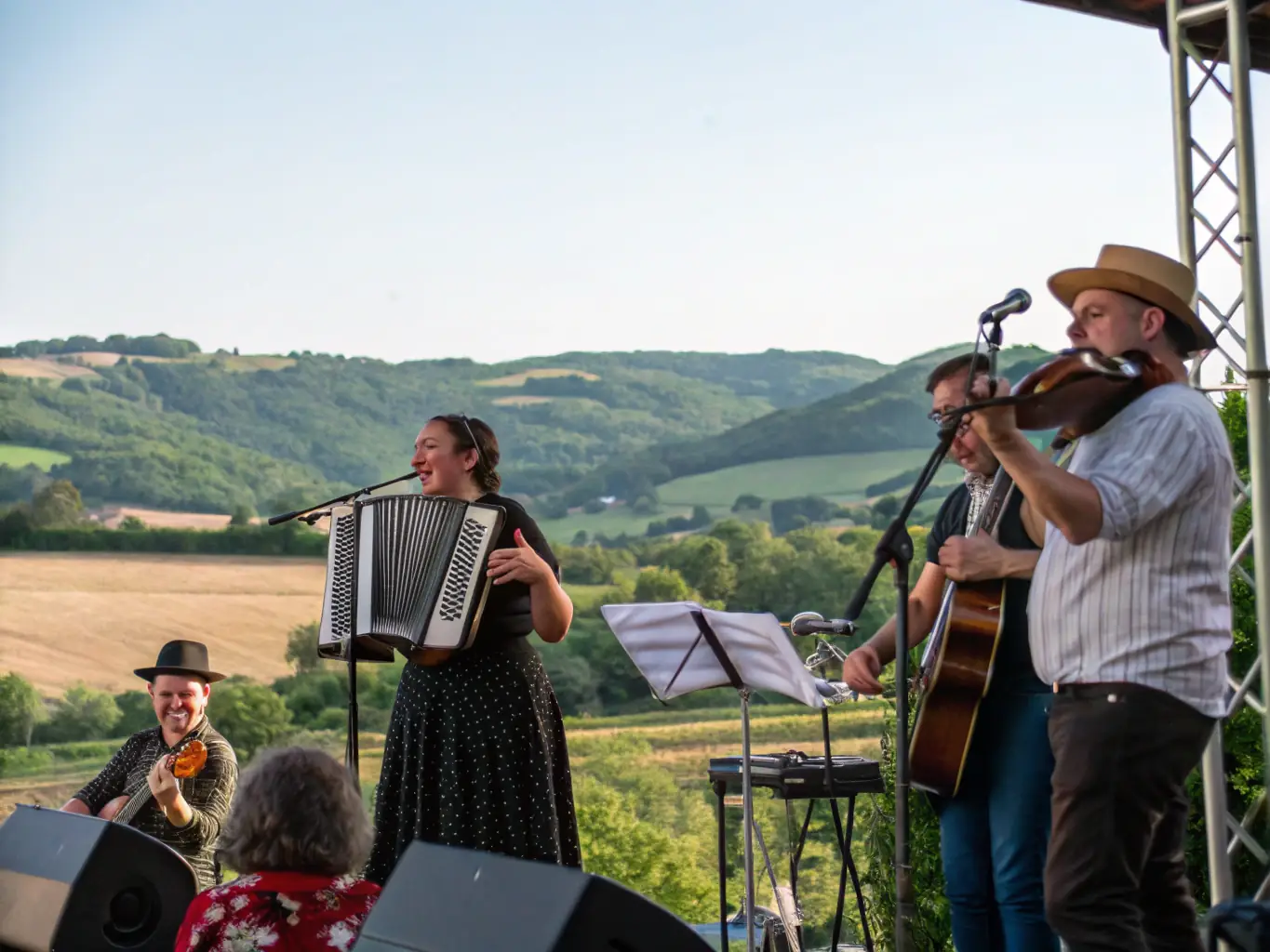 A captivating image of a traditional music performance held at LA MAISON BLEUE, featuring musicians playing local instruments and an engaged audience.